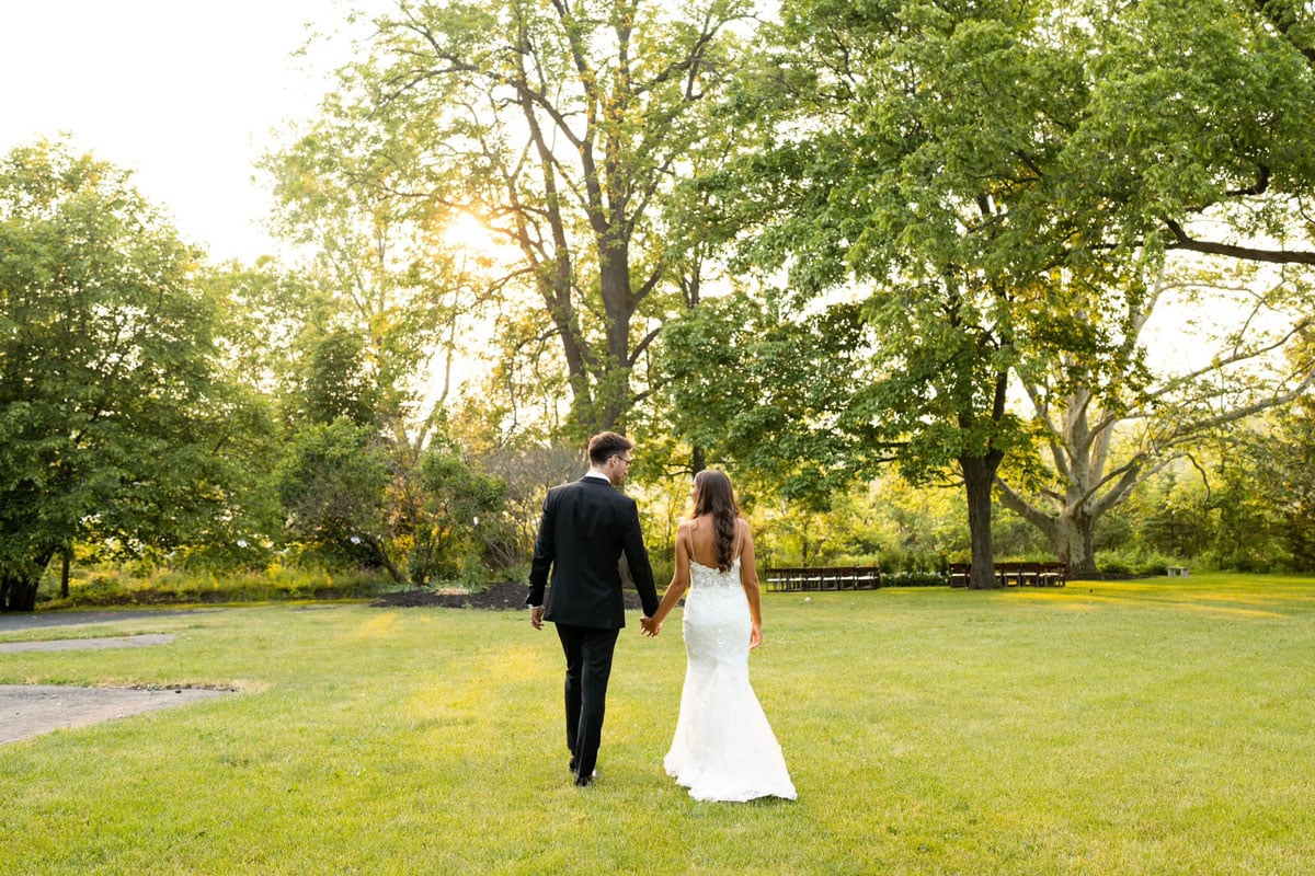 Bride and groom holding hands