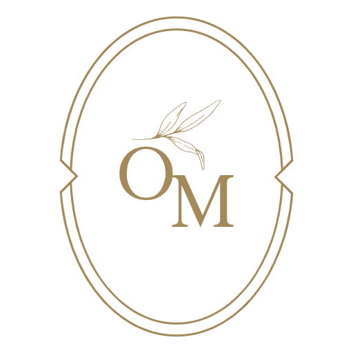 OM logo with a leaf